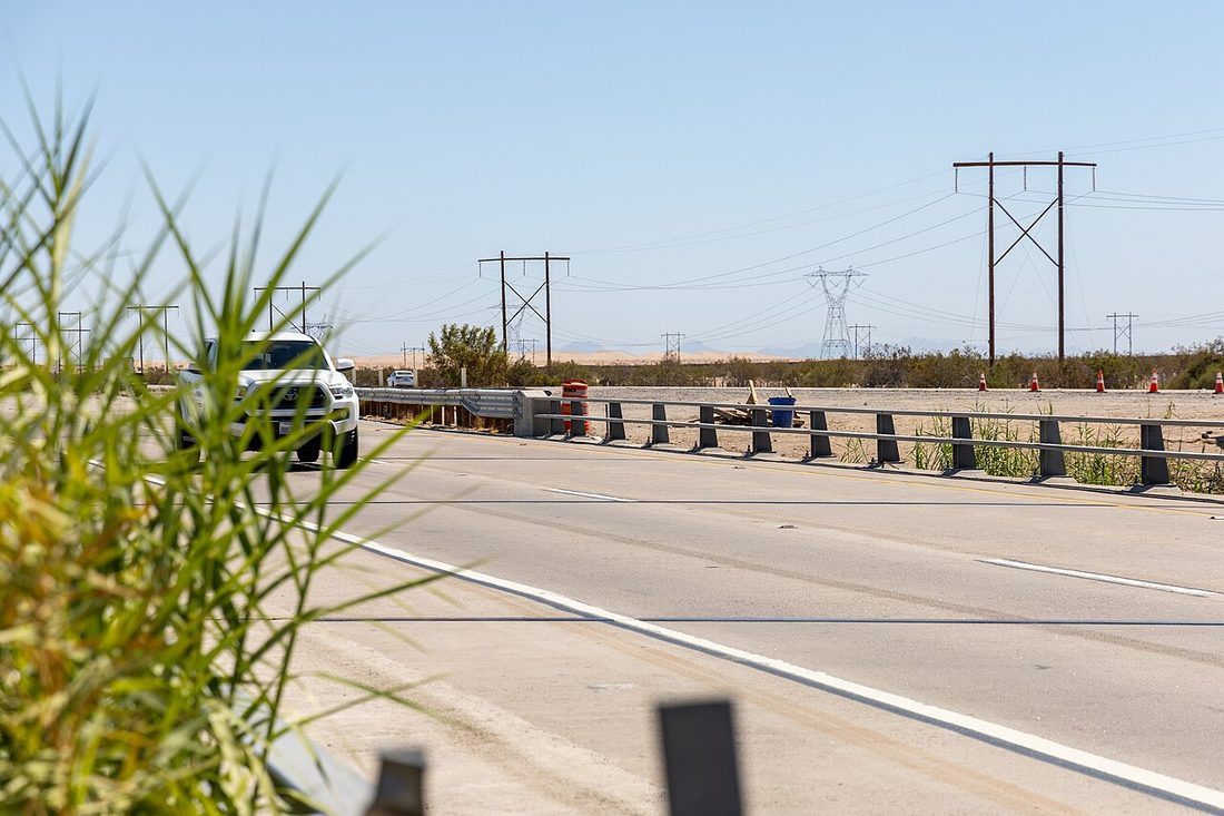 An automated license plate reader concealed inside a highway traffic barrel