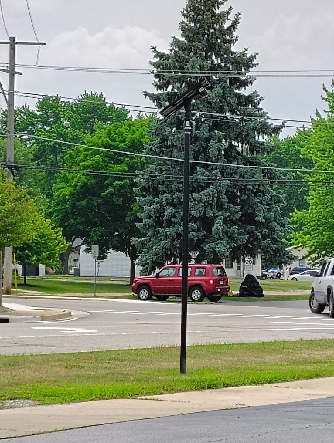 A Flock Safety automated license plate reader camera mounted on a pole